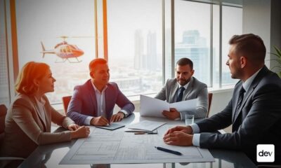 Group of CRE investors at conference table.